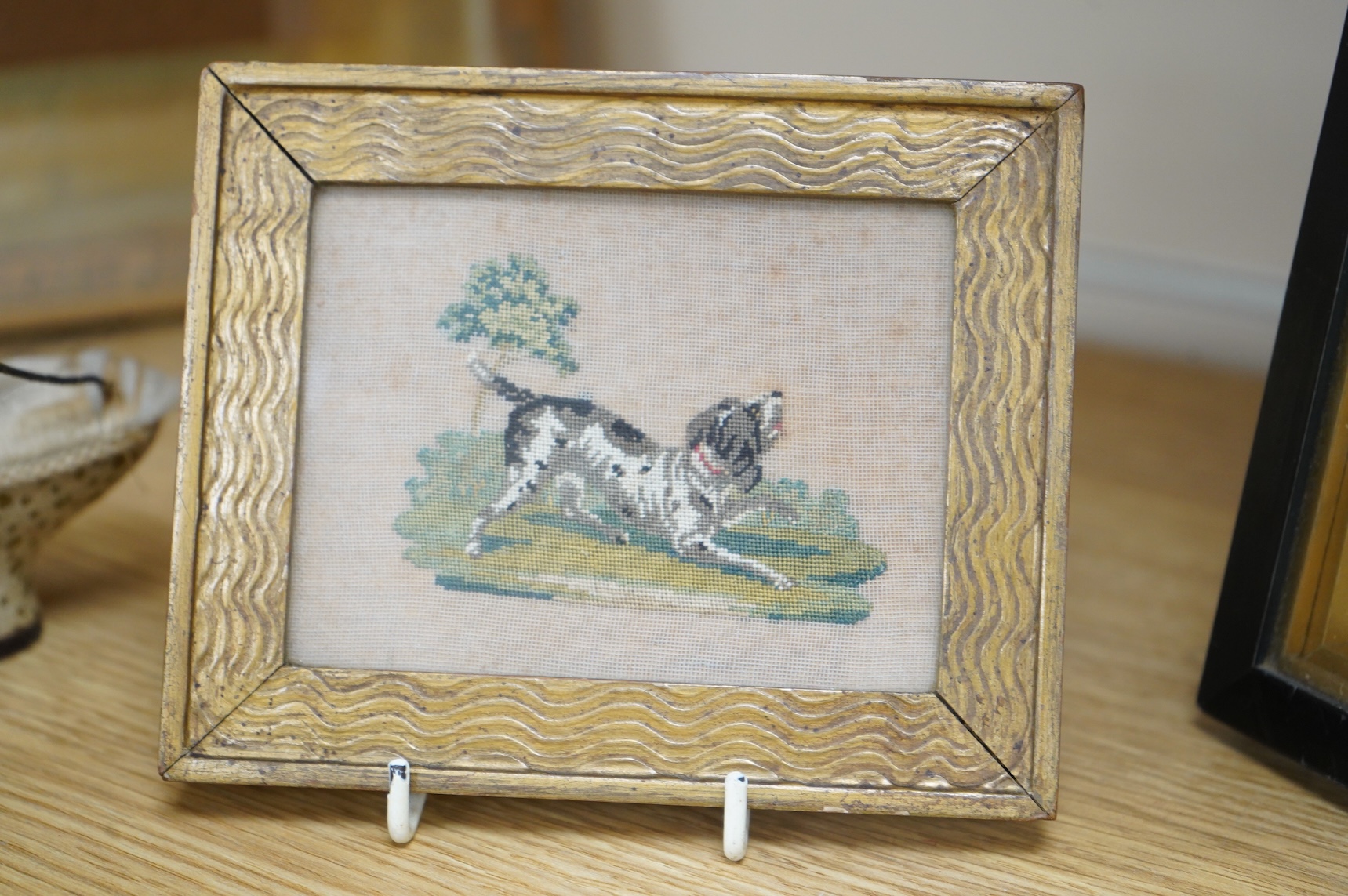 An unusual 19th century stump work needlework embroidery of seated leopard (or dog) in a landscape, together with a smaller petite pointe embroidery of a Spaniel, stump work 17.5cm wide x 9.5cm high. Condition - the back
